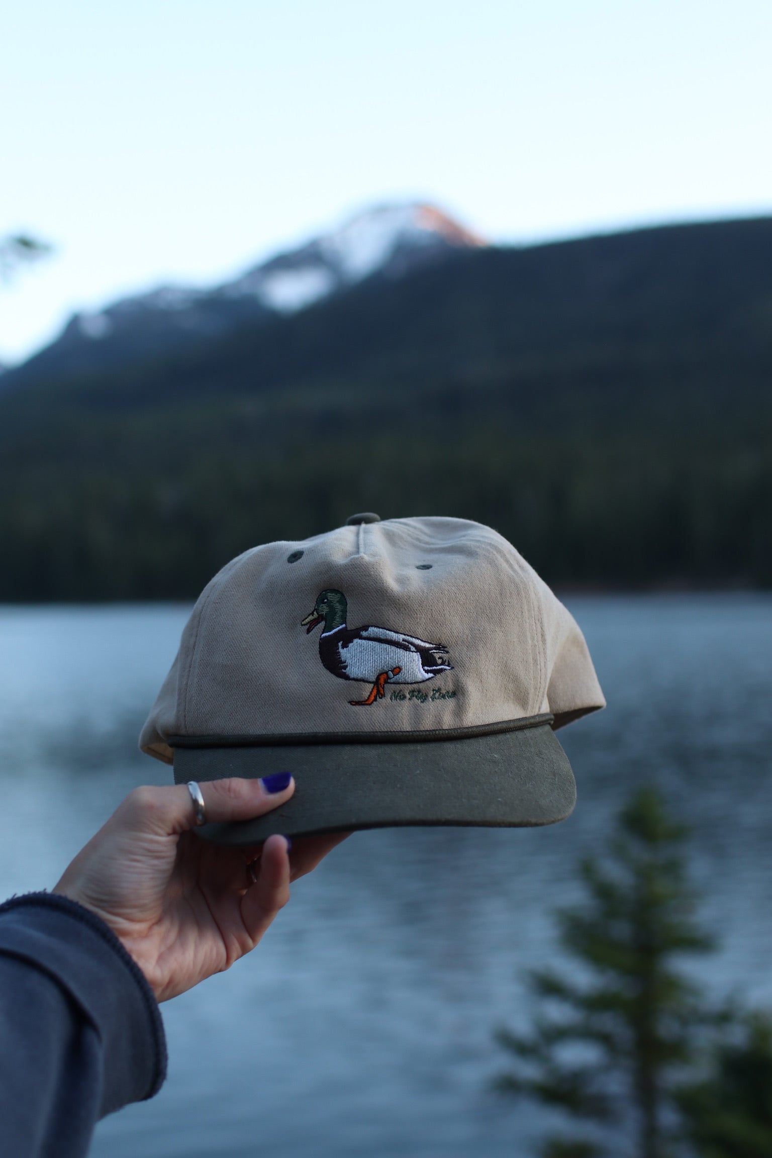 Mallard Rope hat with a mountain background